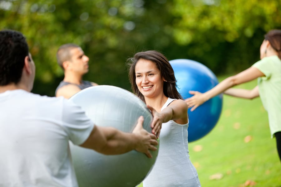 Group of people in a pilates class outdoors